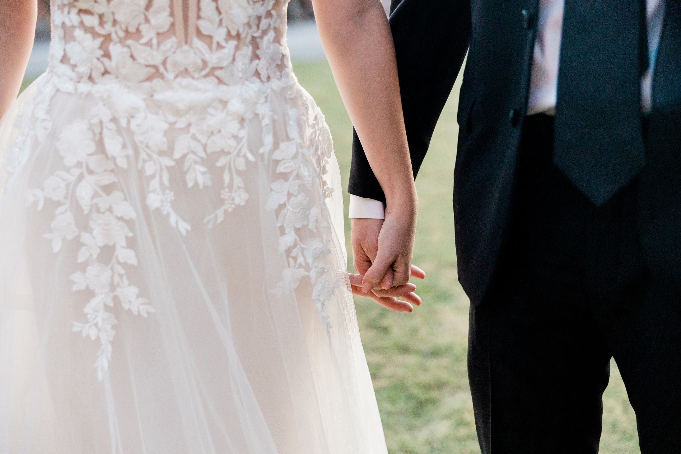 Bride and Groom Holding Hands 